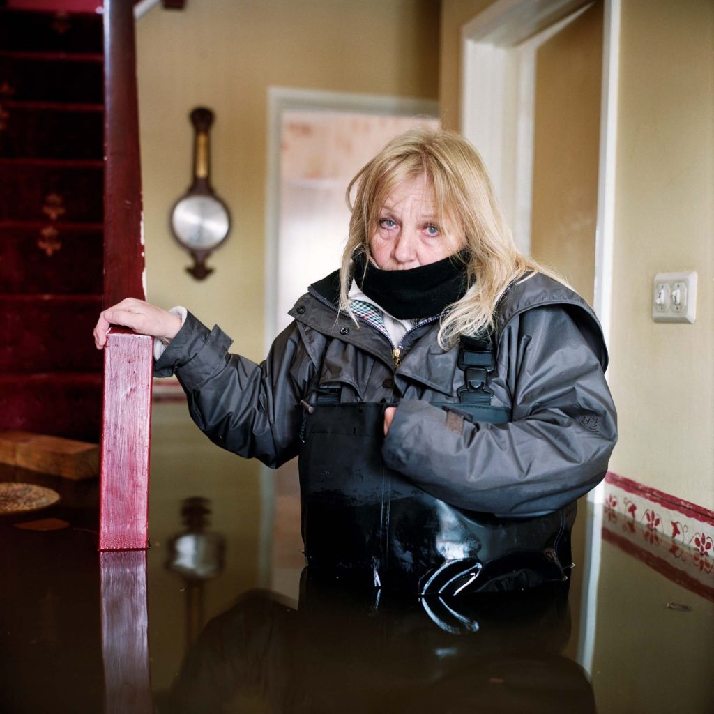 Woman in flooded house