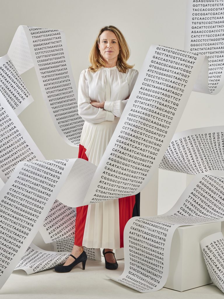 Anna Middleton with base pairs on paper around her