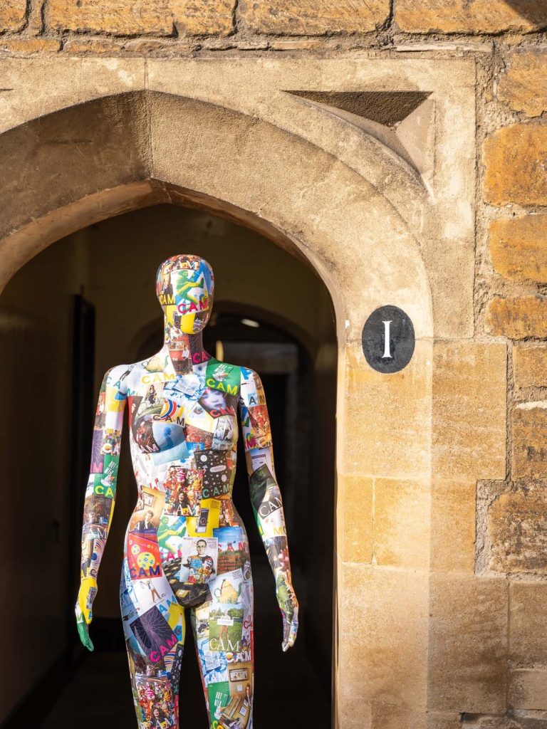 Mannequin covered in CAM magazine covers standing in college doorway